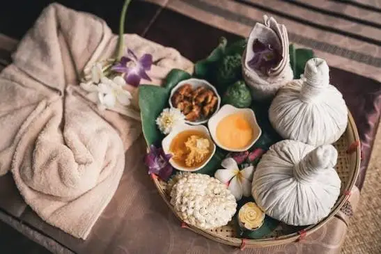 Herbal massage session with warm oils